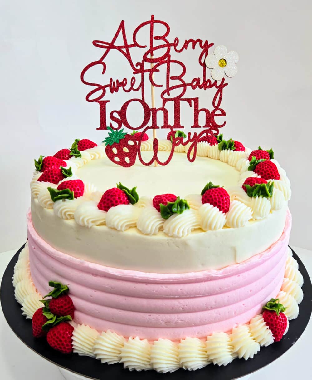 Cake with Strawberries and A Berry Sweet Baby Is on The Way Topper